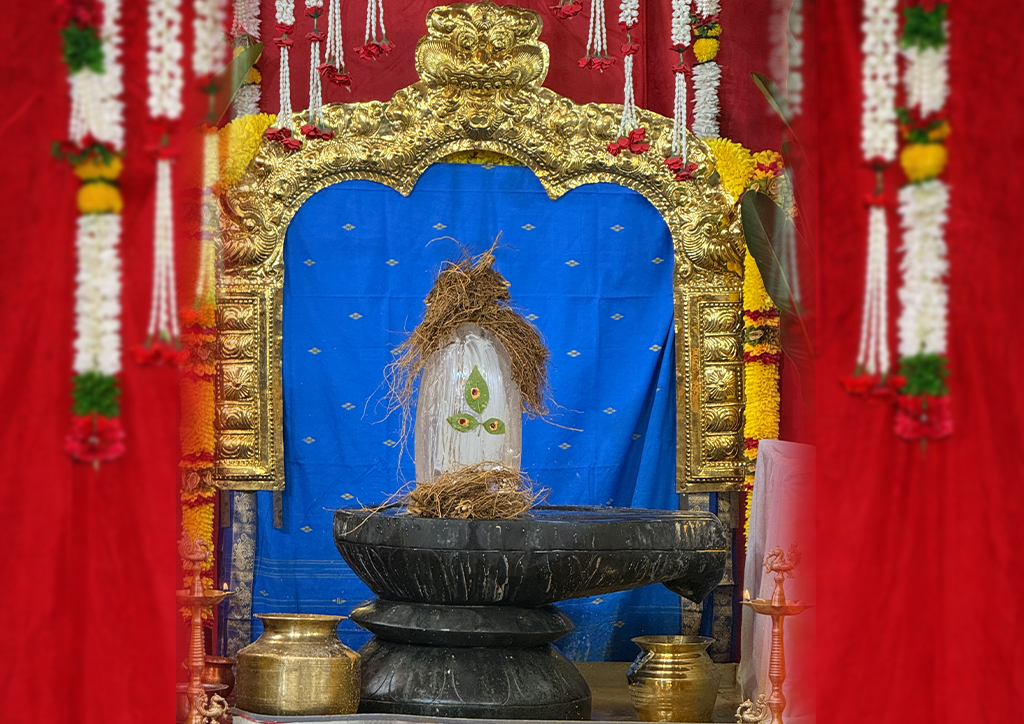 Shiva Lingam decorated with sacred leaves and flowers during Abhishekam at Hari Hara Kshethram temple.